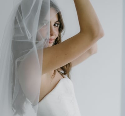 A bride lifting her veil